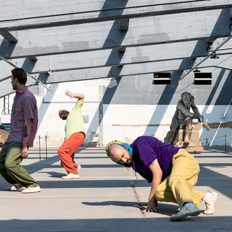 Three dancers moving among sculptures for EMERGE at BUGA 23